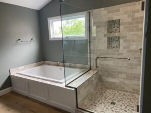 Glass Shower enclosure next to garden tub bath